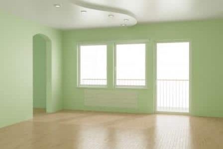 Pintura em sala com paredes verdes.