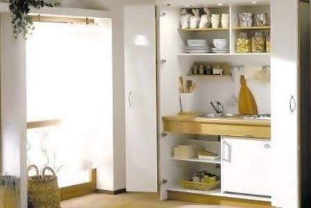 Remodelação de cozinha embutida Cozinha dentro de armário.